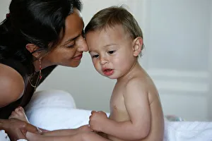 Portraits Prints: Mother kissing baby, Vittel, Vosges, France, Europe