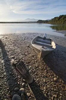 Wooden Post Gallery: Motor boat at sunrise, Okarito Lagoon, West Coast, South Island, New Zealand, Pacific