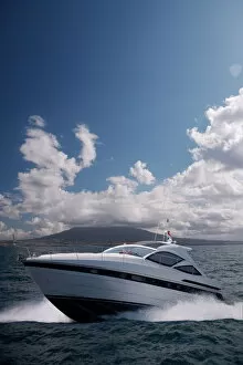 Motor yacht with Mount Vesuvius behind, Bay of Naples, Campania, Italy
