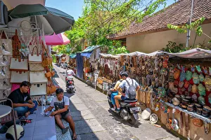 Bali Prints: Motorcycles and souvenir stalls on street in Ubud