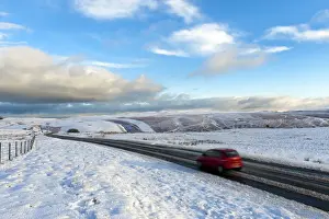 Powys Prints: Motorists negotiate the B4520 road between Brecon and Builth Wells on the Mynydd Epynt moorland