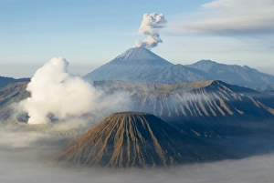 Mount Bromo, a volcano reaching 2392m, and Mount Semeru at 3676m early in the morning