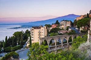 Mount Etna Prints: Mount Etna volcano rising above Taormina at sunrise
