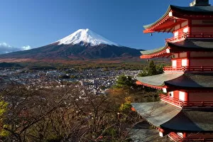 Images Dated 11th November 2006: Mount Fuji capped in snow and the upper levels of a temple
