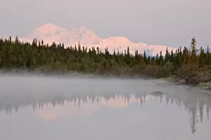 Mount McKinley (Mount Denali) reflected in a lake along the Denali Highway