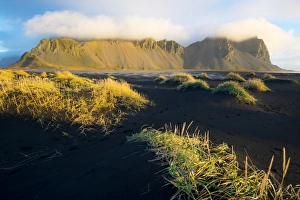 Black Sand Prints: Mount Vestrahorn shrouded in clouds, Stokksnes, Iceland, Polar Regions