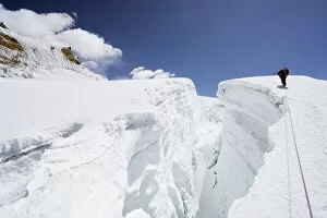 Images Dated 11th April 2010: Mountain guide traversing a crevasse, Island Peak, 6189m, Solu Khumbu Everest Region