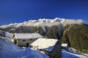 Livrio Valley Prints: Mountain houses framed by snowy peaks, San Salvatore, Livrio Valley, Orobie Alps