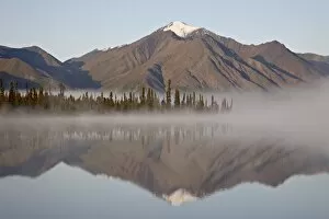 Images Dated 21st August 2009: Mountain reflected in a lake with fog, Denali Highway, Alaska, United States of America