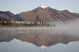 Images Dated 21st August 2009: Mountain reflected in a lake with fog, Denali Highway, Alaska, United States of America
