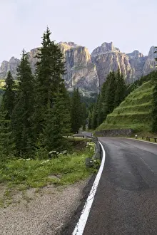 Road Markings Prints: Mountain road and the Sassolungo mountains in the Dolomites near Canazei