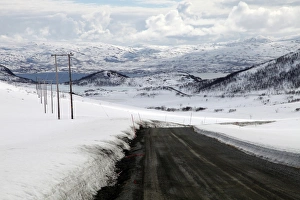 Absence Prints: Mountain road in spring, Kvaloya (Whale Island), Troms, arctic Norway, Scandinavia, Europe