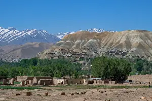 Altitude Prints: Mountain scenery shows hills and snow-capped peaks with houses in the valley near Bamyian