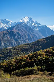Season Prints: Mountain scenery with snow-capped peaks and autumn colors in North Ossetia, Russia