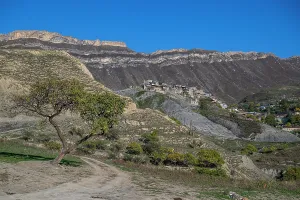 Slopes Prints: Mountain village life and landscape in Dagestan surrounded by rugged cliffs and clear blue sky