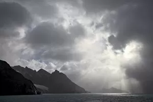 Dramatic Skies Collection: Mountainous coastline near Drygalski Fjord with cloudy skies