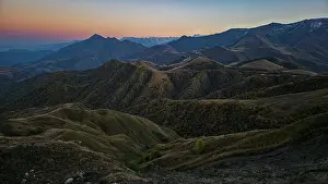 Ecology Prints: Mountains of Chechnya offer a view of vast terrain and changing colors at dusk in the Caucasus region of Russia