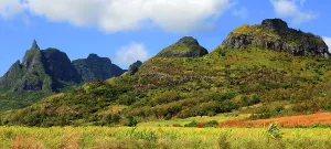 Peaks Prints: Mountains rise in central Mauritius under blue sky with scattered clouds