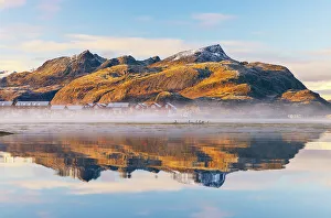 Lofoten Islands Prints: Mountains and rorbuer reflected in a Fjord during sunset