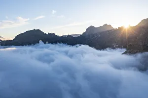 Solar Flare Prints: Mountains in a sea of clouds at sunset viewed from Pico Ruivo, Madeira, Portugal