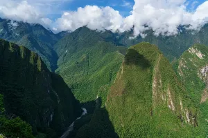 Trail Prints: Mountains surrounding the Inca site at Machu Picchu display lush greenery
