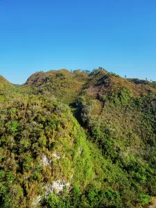 Ecosystems Prints: Mountains surrounding Semuc Champey in Lanquin show lush vegetation