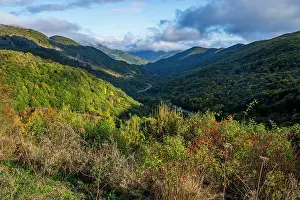 Fresh Prints: Mountains and valleys show nature in South Ossetia with green forests and open sky during clear weather