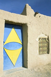 Mud house with colourful door