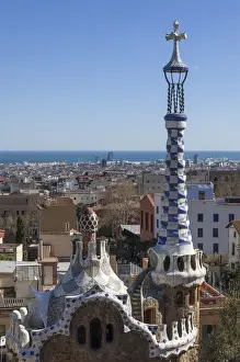 Stereotypically Spain Prints: Multi coloured and patterned glazed ceramic work decorates a roof in Parc Guell