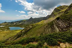 Slopes Prints: Multiple mountain lakes and rocky slopes in Rila Mountains under partly cloudy sky in Bulgaria