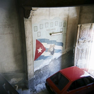 Leader Prints: Mural of Camilo Cienfuegos on the wall of an apartment building, Havana