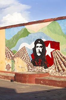 Leader Prints: Mural of Che Guevara painted on a wall in a local school, Trinidad, Cuba
