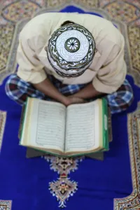 Robes Prints: Muslim man reading the Quran in mosque, Ho Chi Minh City, Vietnam, Indochina
