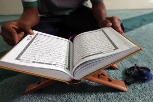 Quran Prints: Muslim reading the Quran in Mosque, Ho Chi Minh City, Vietnam, Indochina, Southeast Asia