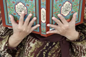 Human Hand Prints: Muslim woman reading the Quran, The National Mosque (Masjid Negara), Kuala Lumpur