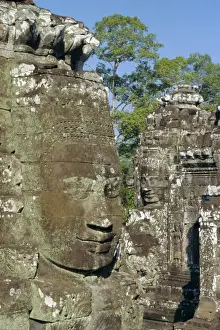 Myriad stone heads typifying Cambodia in the Bayon Temple, Angkor, Siem Reap, Cambodia