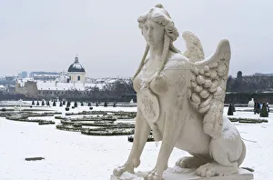 Vienna Prints: Mythological statue in the snow covered Belvedere Garten, gardens of castle housing