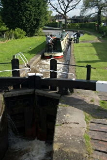 Shropshire Collection: Narrow boat on the Llangollen Canal going through the locks at Grindley Brook