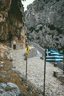 Patriotism Prints: Narrow road crossing Kotsifou gorge nearby the old Agios Nikolaos chapel built in rocks