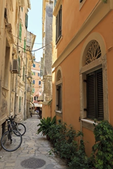 Narrow street with bike, Old Town, Corfu Town, Corfu, Ionian Islands, Greece