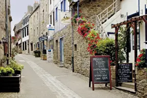 Treguier Prints: Narrow street with half timbered houses and seafood restaurants, Treguier