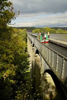 Narrowboat crossing the River Dee in autumn on the Pontcysyllte Aqueduct, built by Thomas Telford