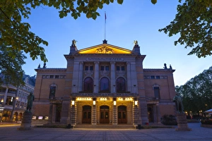 Traditionally Norwegian Prints: National Theatre illuminated at dusk, Oslo, Norway, Scandinavia, Europe