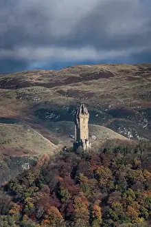 Stirling Prints: The National Wallace Monument on Abbey Craig backed by the Ochil Hills in autumn