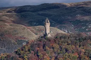 Stirling Prints: The National Wallace Monument on Abbey Craig backed by the Ochil Hills in autumn