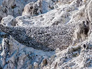 Settlement Prints: Natural dam built by Yaqui Indians for guano mining on Isla San Pedro Martir in Baja California