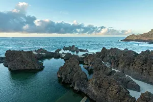 Swim Prints: Natural volcanic rock swimming pools at sunset