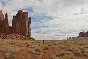 Images Dated 23rd October 2010: Navajo person rides a horse between rock formations, Monument Valley Navajo Tribal Park