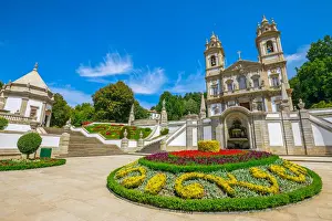 Minho Prints: Neoclassical Basilica of Bom Jesus do Monte surrounded by gardens on a sunny day