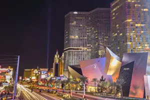 Neon lights, Las Vegas Strip South at night with cars leaving light streaks in front of City Center, Las Vegas, Nevada, United States of America, North America